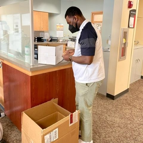 Purdue University PhD Student Edem Fabrice marks samples at Blackford Hospital